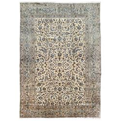 Persian Kashan ivory ground carpet, overall floral design with stylised flowerheads and trailing leafy branches, repeating border with stylised peony motifs, with multiple guard bands