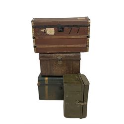 Four different trunks, including travelling trunk and three steamer trunks