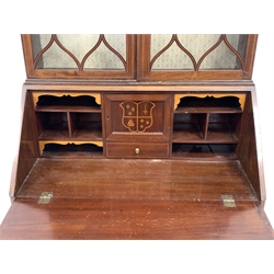 Edwardian mahogany bureau bookcase, the upper section enclosed by a pair of glazed tracery doors, with boxwood and ebony stringing, hinged fall under inlaid with a shell and trailing garlands, the interior with small drawer, pigeon holes and cupboard inlaid with a crest, four long graduated drawers under, with further floral inlay, on splay supports, W78cm, H201cm, D42cm