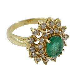 Gold oval emerald and round brilliant cut diamond cluster ring, stamped 14K