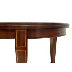 Edwardian inlaid mahogany telescopic extending dining table, moulded oval top with two additional leaves, on square tapering supports with spade feet and brass castors