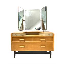E Gomme for G-Plan - 'Brandon' range mid century vintage light oak dressing table, the three swing mirrors over two trinket drawers, tow short and one long drawer to base, raised on ebonised turned supports W108cm, H140cm, D44cm