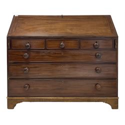 Henry Walker of Lancaster - George III mahogany bureau, fall front enclosing fitted interior, three short drawers over three long drawers, bracket supports