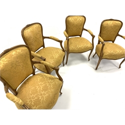Set four French beech open armchairs, the exposed moulded frame decorated with floral carvings, arm rests, seat and back panel upholstered in yellow damask, raised on cabriole supports,   W60cm