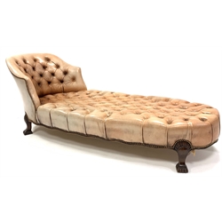 Georgian style chaise longue, with tub shaped raised back rest, upholstered in deep buttoned and studded leather, raised on lobe carved walnut supports, L200cm, H75cm, D80cm