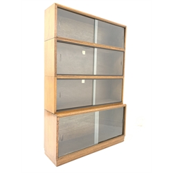  Early 20th century 'Simplex' oak stacking library bookcase with four shelves, each with sliding glass doors, W92cm, H140cm, D29cm   