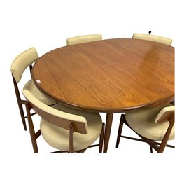 Victor B Wilkins for G-Plan - mid-20th century circular teak extending dining table; and set six matching teak dining chairs, back and seats upholstered in cream leather, on tapered supports united by cross stretcher