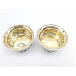 Pair of George III silver circular salts with gilded interiors and engraved with a band of trailing foliage D8cm London 1805 Maker Robert and Samuel Hennell 3.8oz