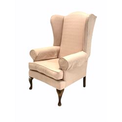 20th century walnut framed wingback armchair, upholstered in pink fabric with squab cushion, raised on cabriole front supports W82cm