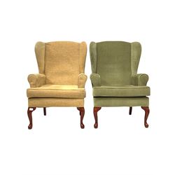 Pair of Queen Anne style wing back armchairs with squab cushion, upholstered in different fabrics, raised on cabriole supports