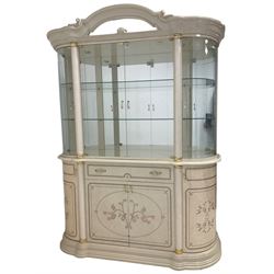 Italian marble effect display cabinet, arched pediment with mirror flanked by cartouche and scrolling, fitted with glass upper section with two shelves, central glazed double doors flanked by column uprights with gilt capitals, rounded doors to each side above central single drawer and cupboards with shaped ends, raised on shaped plinth base