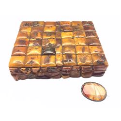 20th century Continental cigarette box applied with Amber type tiles, L26cm x D19cm together with an early 20th century brooch set with agate centre and white metal frame (2)