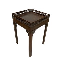 George III Chippendale design mahogany silver table, square top with raised fretwork gallery over banded frieze, raised on square chamfered supports with pierced foliate carved brackets
Provenance: From the Estate of the late Dowager Lady St Oswald