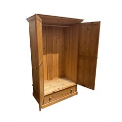 Rustic pine double wardrobe, two panelled doors over single drawer