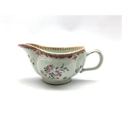 18th century porcelain sauceboat hand-painted with floral sprays beneath a pink scale border, L20cm 