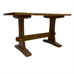 Acornman - oak coffee table, rectangular adzed top on shaped end supports joined by pegged stretcher, on sledge feet, carved with acorn signature, by Alan Grainger, Brandsby, York