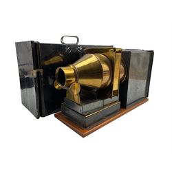 Magic lantern with brass lens in metal case