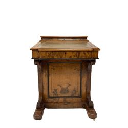 Victorian walnut davenport, removable top section with correspondence compartment over sloped top with green inset, the interior fitted with drawers, the lower section fitted with cupboards, on brass and ceramic castors 