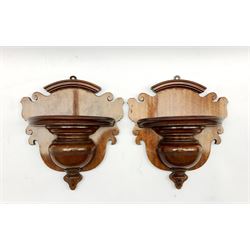 A pair of late Victorian mahogany wall brackets, shaped crestings, demi-lune plateux, turned aprons, H28cm x W26cm 