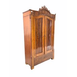 Continental mahogany veneered hanging wardrobe, with two panelled doors, raised on block supports W111cm