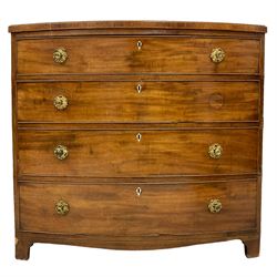 Regency mahogany bow front chest, the top with ebony and satinwood stringing, fitted with four cockbeaded drawers with brass pull handles and bone escutcheons, on bracket feet, the top drawer with paper label inscribed ‘Snowdon & Son, joiners and cabinet-makers, near the church, Northallerton’