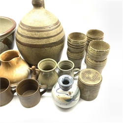 Donald Glanville (British b. 1977) large stoneware stem bowl D28cm,  Andrew Hague (British b.1974) stoneware vase, Curlew Pottery, Otley stoneware bowl, cylindrical jar and cover, cider jar and six similar beakers, two pieces of Aberfeldy pottery, three brown glazed stoneware mugs etc