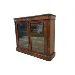 Victorian figured walnut pier cabinet, rectangular top with moulded edges over banded frieze inlaid with satinwood foliate decoration, fitted with two glazed doors enclosing two shelves with satinwood stringing, on plinth base