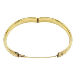 Gold hinged bangle with bright cut decoration