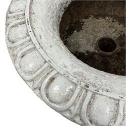 White painted cast iron bowl shaped urn, egg and dart moulded rim and gadrooned underbelly, on moulded foot and square base