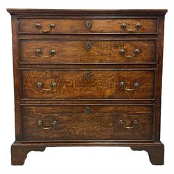 18th century oak chest, rectangular top with moulded edge, fitted with four graduating cock-beaded drawers, each with oval brass escutcheons and drop handles, lower moulded edge over bracket feet