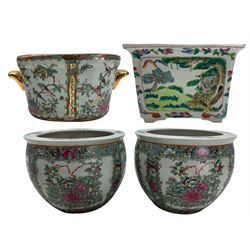 Pair of 20th century Chinese Canton fish bowls, decorated with panels of flowers and foliage on a dense floral ground, the interiors painted with fish, H14cm, together with two Chinese jardinieres (4) Provenance: From the Estate of the late Dowager Lady St Oswald