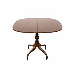 Regency mahogany fold over tea table, the bowed and cross banded top folding and revolving over boxwood strung frieze, raised on turned supports and four inverted splayed supports with castors W91cm
