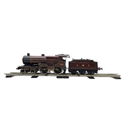 Hornby O gauge clockwork 4-4-0 1185 locomotive and tender in LMS Crimson, with two pieces of display track and key
