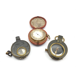 World War I marching compass in a leather case inscribed C & R Brinsley 1916, another and a pocket barometer in outer leather case 