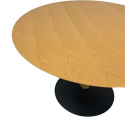 Contemporary light beech extending dining table, circular pull-out action top with additional leaf, on sculptural curved horn-shaped pedestal and circular black finish cast iron base  