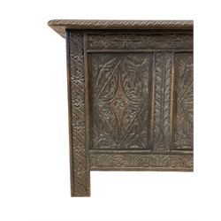 17th century design oak coffer or chest, rectangular hinged top with gadrooned edge, the panelled front carved with three foliate lozenges, flanked by stylised palm uprights, the lower frieze rail carved with lunettes, on stile supports