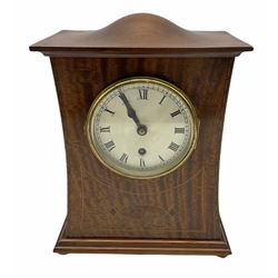 A twentieth century mahogany mantle clock with a waisted case in the art Nuovo style, contrasting satinwood stringing and  oval birds-eye maple inlay, rectangular stepped plinth raised on four wooden bun feet, top with an elongated sphere and ogee surround, Coventry eight-day Astral timepiece movement with a lever platform escapement and fast/slow regulation, movement number 14818, polished brass bezel with bevelled glass, silvered dial with roman numerals and minute track, with matching steel spade hands. 
With key.