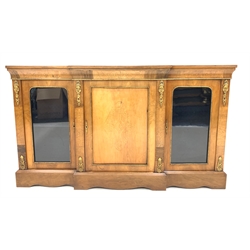 Victorian walnut and satinwood break front credenza, with ormolu floral boxwood inlay to frieze over central panelled door with further inlay, enclosed by two glazed doors, raised on bracket supports, W17cm, H101cm, D34cm