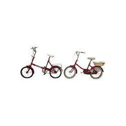 Two vintage red children’s bikes