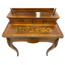 Early to mid-20th century French satinwood and marquetry Bonheur du Jour,  the raised shaped back with a gilt metal ribbon tied mount, projecting shelf with turned gilt metal supports over mirror back, fitted with two drawers, inlaid with musical instruments with ribbon and laurel leaf motifs, the top inlaid with trailing oak leaves and acorns with a central torch, gilt metal foliate moulded and twist edge mounts, the single drawer with a scrolling foliate inlaid front fitted with baize lined slide revealing storage well, cabriole supports mounted with putto and floral castings and foliate terminal caps