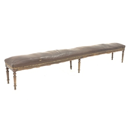 19th century French beech framed long bench, seat fully sprung and upholstered in leather, on turned supports, total length 310cm, seat height - 52cm, D43cm