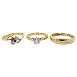  9ct gold two stone diamond crossover ring, 14ct gold single cubic zirconia ring and one other 9ct gold single stone cubic zirconia ring