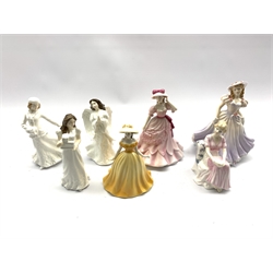 Three Royal Doulton figures Christmas Parcels, Christmas Angel and Skating, two Royal Worcester figures and two others