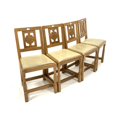 Set four 'Squirrelman' Yorkshire oak dining chairs, Yorkshire rose carved back panel over leather upholstered seats, raised on octagonal turned supports united by 'H' stretcher, W45cm - Mouseman interest 