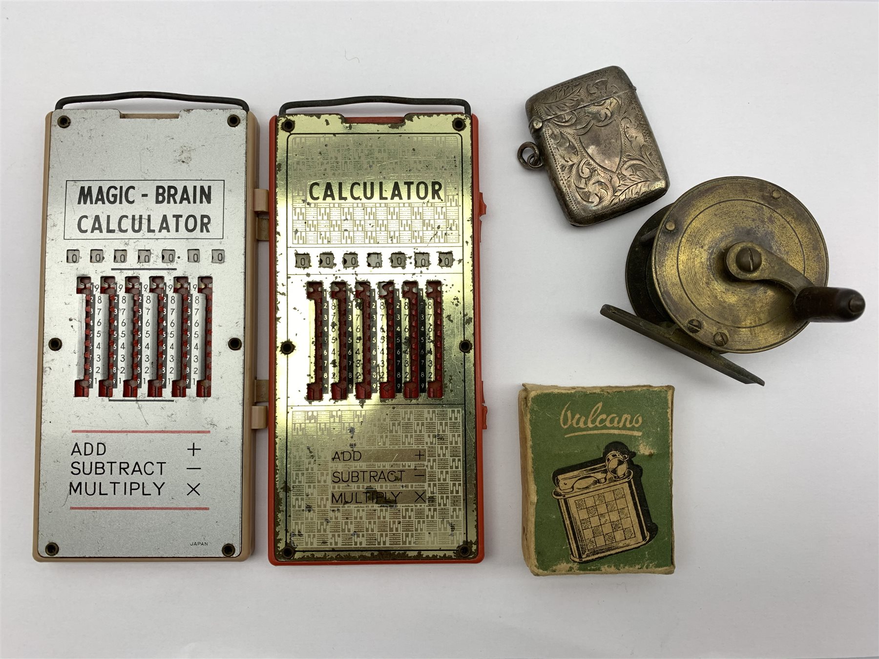 DS Victorian silver vesta case by William J Holmes, Birmingham, 1886, brass  fly reel, Vulcano lighter in original box and two 'Magic-Brain' Calculators  (5 - Antiques, Fine Art & Collectors