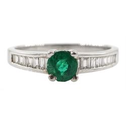 Platinum round emerald ring, with baguette diamond channel set shoulders, stamped PT950