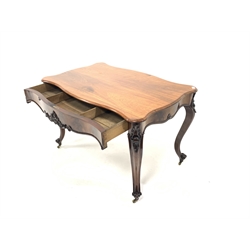 Early 19th century figured mahogany centre table, serpentine top, frieze drawer with shaped apron and applied floral decoration, raised on scrolled cabriole supports terminating in brass castors, 125cm x 76cm, H78cm