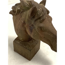 Pair of cast iron horse heads, on square bases, H63cm