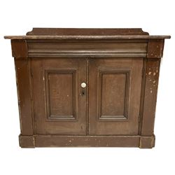 Victorian scumbled pine standing cupboard, raised back over rectangular top with rounded corners, fitted with two panelled doors enclosing single shelf, on plinth base