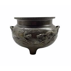 19th century Japanese bronze two handled jardiniere decorated with a raised pattern of dragons etc and with interior decoration on three short feet D30cm